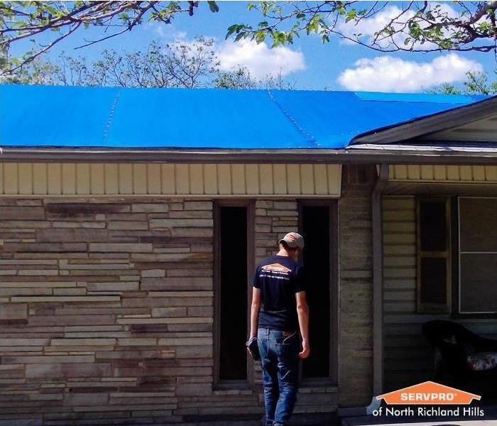 tarp on a damaged roof