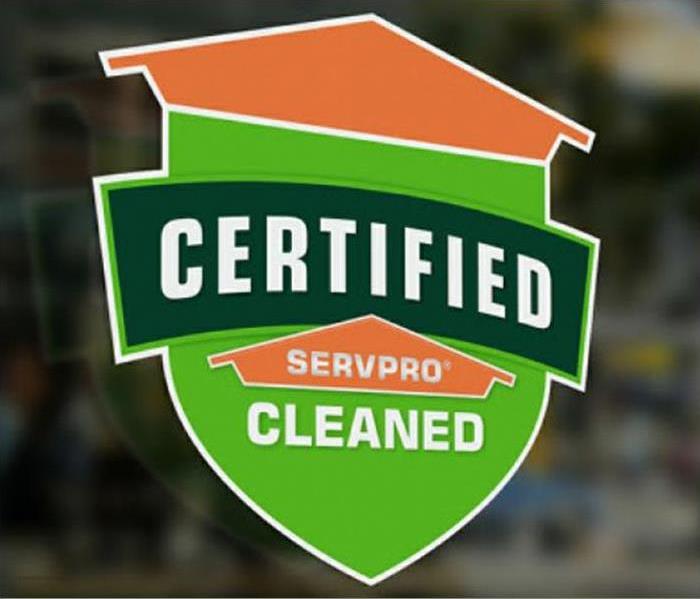 Certified: SERVPRO Cleaned badge on a window.
